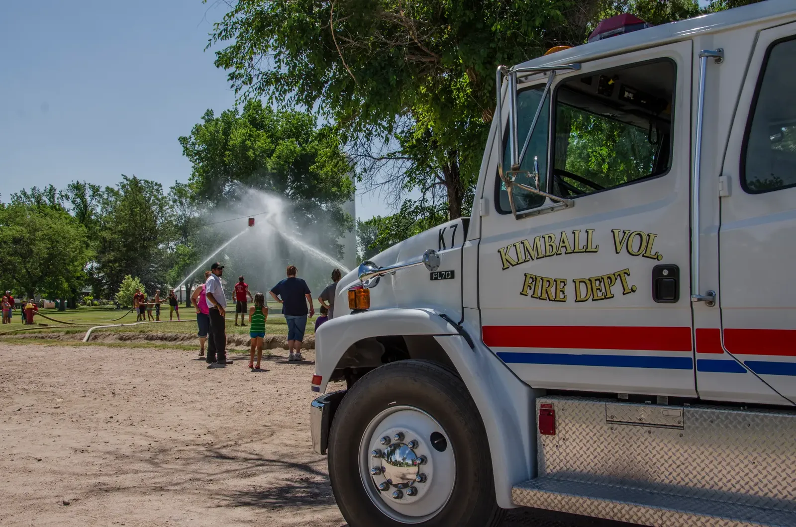 Kimball Volunteer Fire Department truck spraying water at a community event